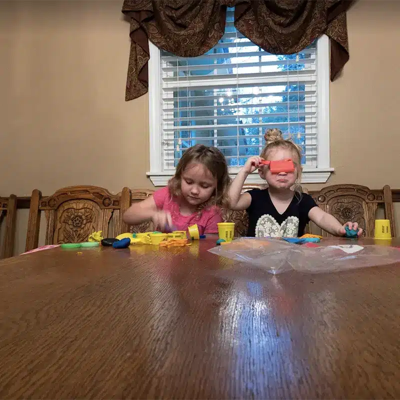 Kids Playing At Table